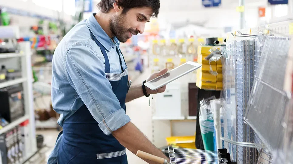 Retail worker looking at tablet